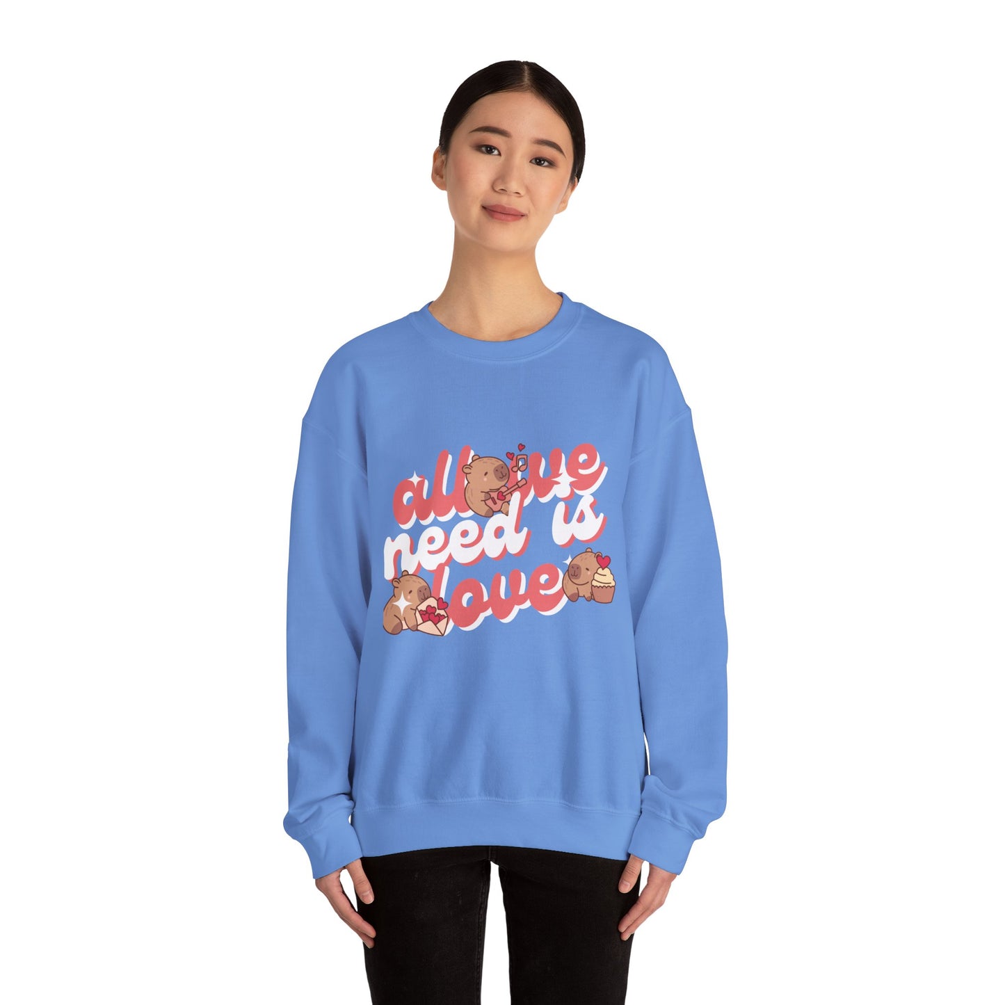 All We Need Is Love Graphic Sweatshirt - Cute Capybara Valentine's Day Sweater for Cozy Comfort Unisex Heavy Blend™ Crewneck Sweatshirt