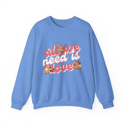 All We Need Is Love Graphic Sweatshirt - Cute Capybara Valentine's Day Sweater for Cozy Comfort Unisex Heavy Blend™ Crewneck Sweatshirt