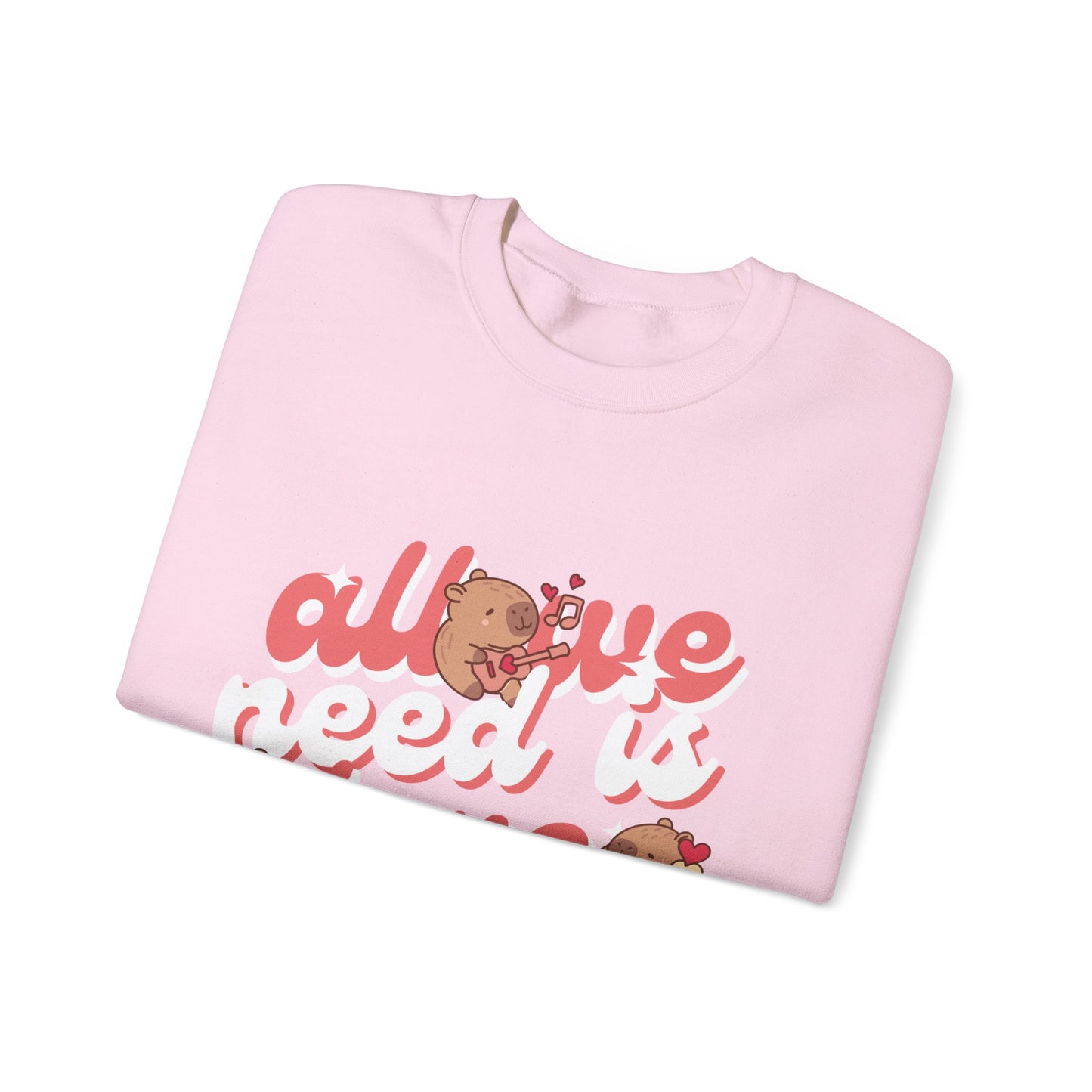 All We Need Is Love Graphic Sweatshirt - Cute Capybara Valentine's Day Sweater for Cozy Comfort Unisex Heavy Blend™ Crewneck Sweatshirt