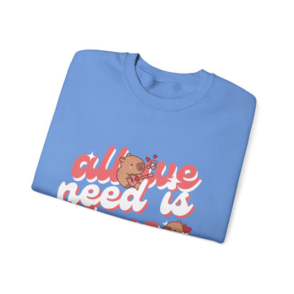 All We Need Is Love Graphic Sweatshirt - Cute Capybara Valentine's Day Sweater for Cozy Comfort Unisex Heavy Blend™ Crewneck Sweatshirt