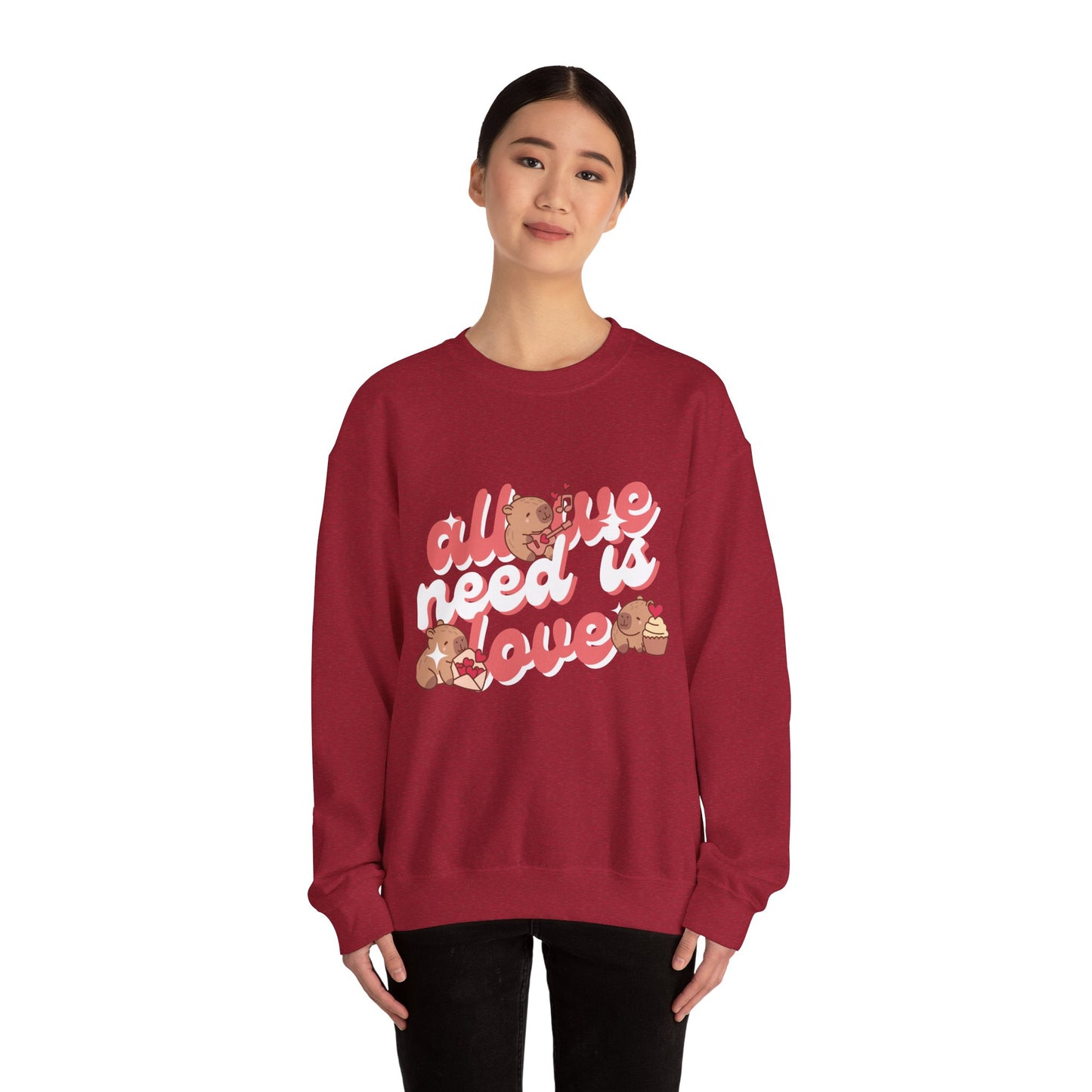 All We Need Is Love Graphic Sweatshirt - Cute Capybara Valentine's Day Sweater for Cozy Comfort Unisex Heavy Blend™ Crewneck Sweatshirt